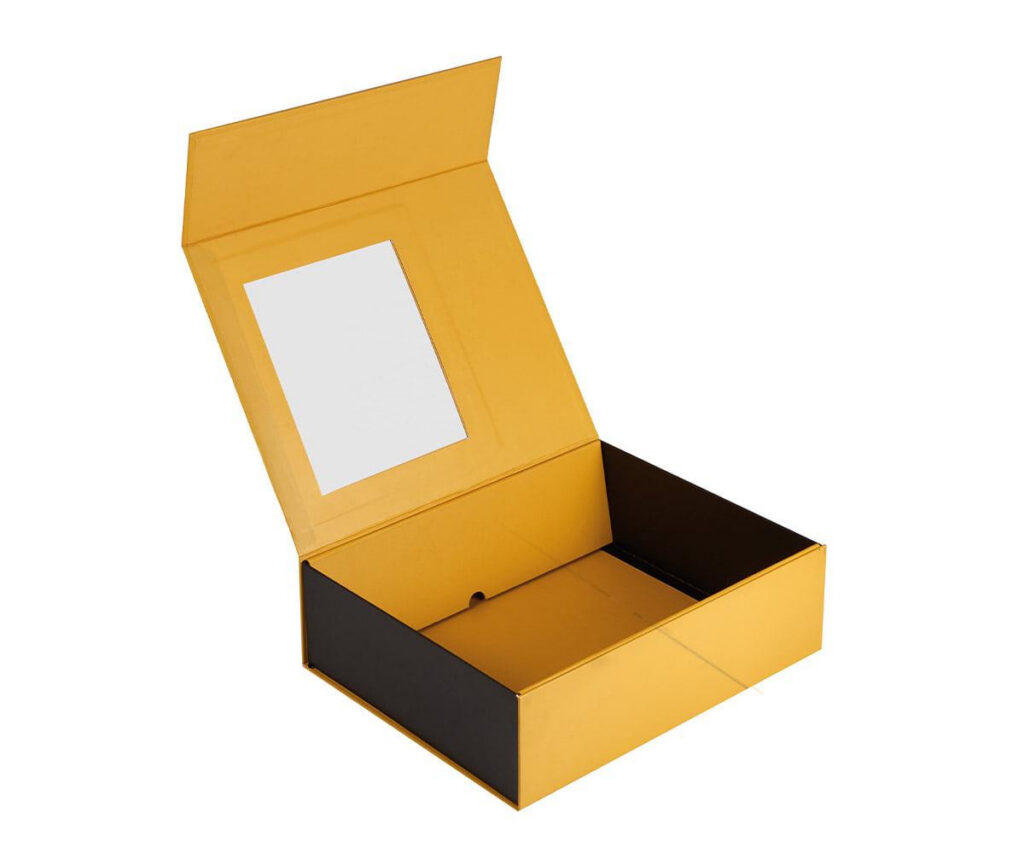 Yellow magnetic rigid gift box with clear PVC window, open lid, black interior, premium rigid packaging for cosmetics or retail products.