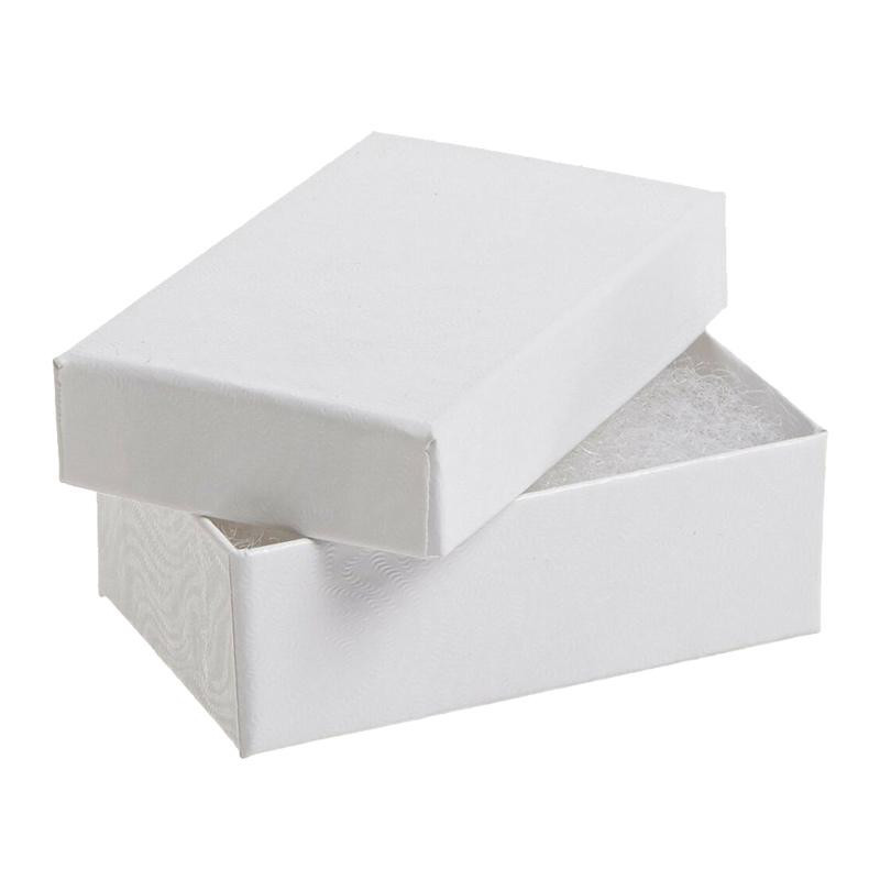 White rigid gift box with lid slightly open, lined with shredded paper, premium rigid packaging for jewelry, small gifts or retail items.