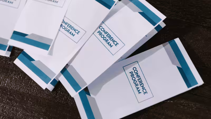 several brochures about "conference program"