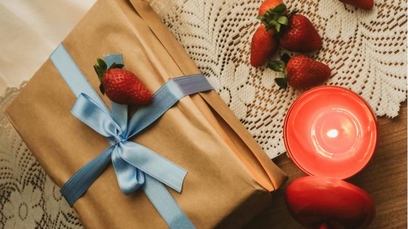 candle and a candle gift box packaging on a table