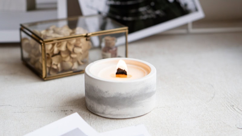 candle in a ceramic container