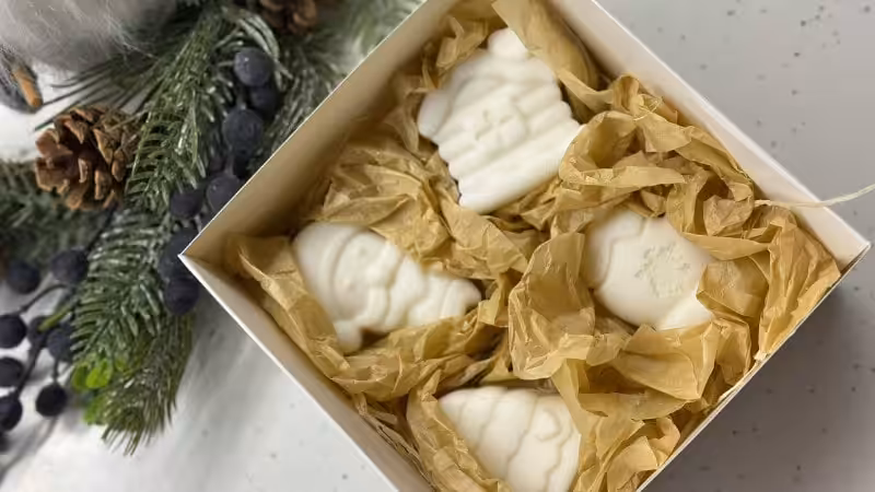 4 soaps putting in a box within tissue paper