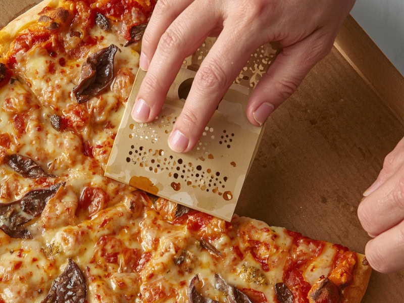 Smart food packaging design with perforated grips for pizza slices, alongside convertible canister‑to‑bowl packaging to enhance user‑friendly sharing experience
