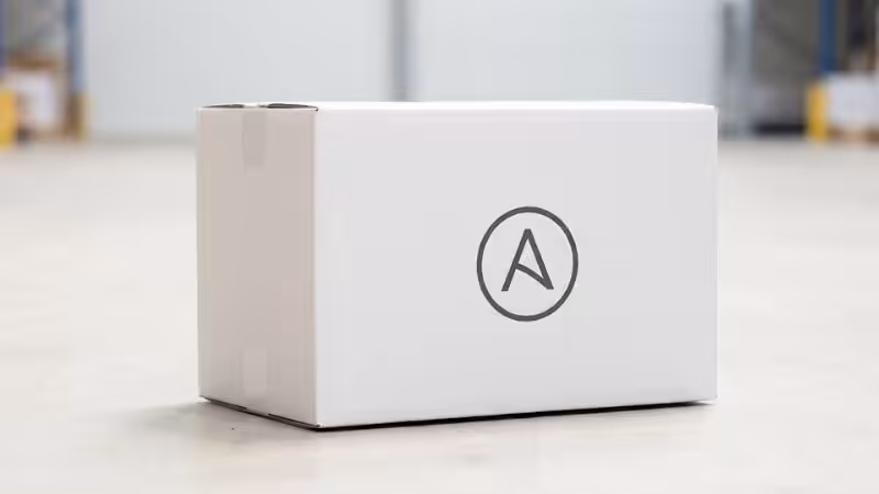 a white shipping box with a simple, centered logo