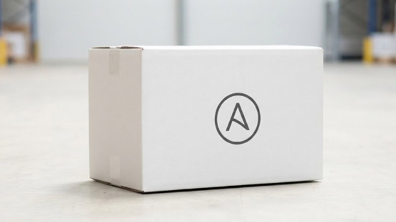 a white shipping box with a simple, centered logo