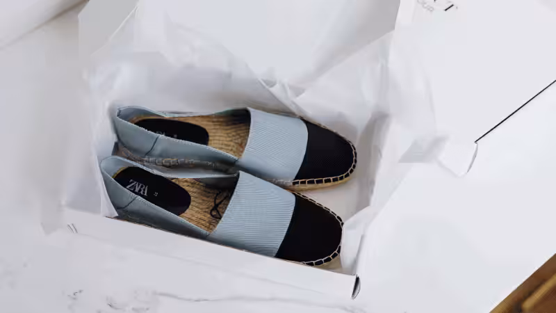 a pair of zara shoes in a shoe box