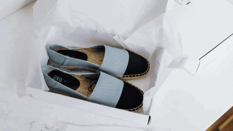 a pair of zara shoes in a shoe box