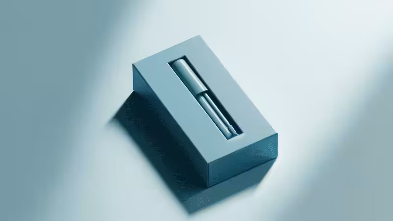 Minimalist light blue lip gloss packaging, featuring a recessed slot to hold a sleek lip gloss tube.