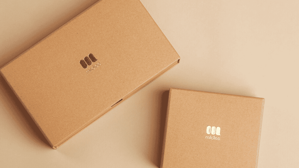 Two brown boxes with the logo on them