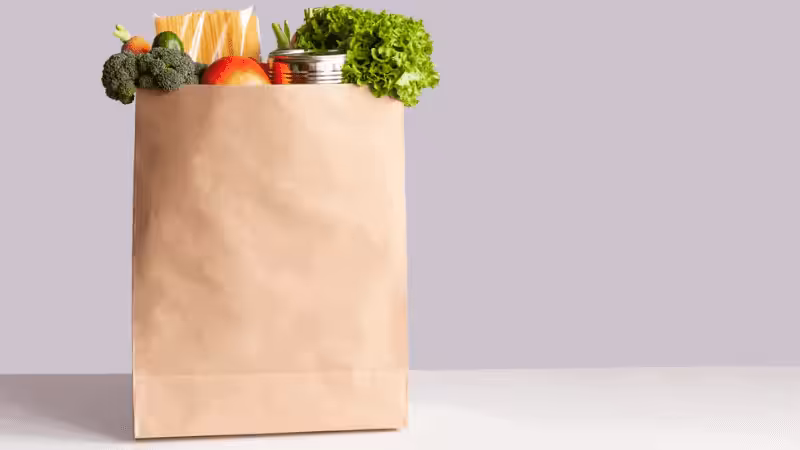 A paper bag filled with groceries
