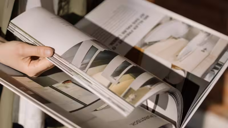 someone is reading a magazine