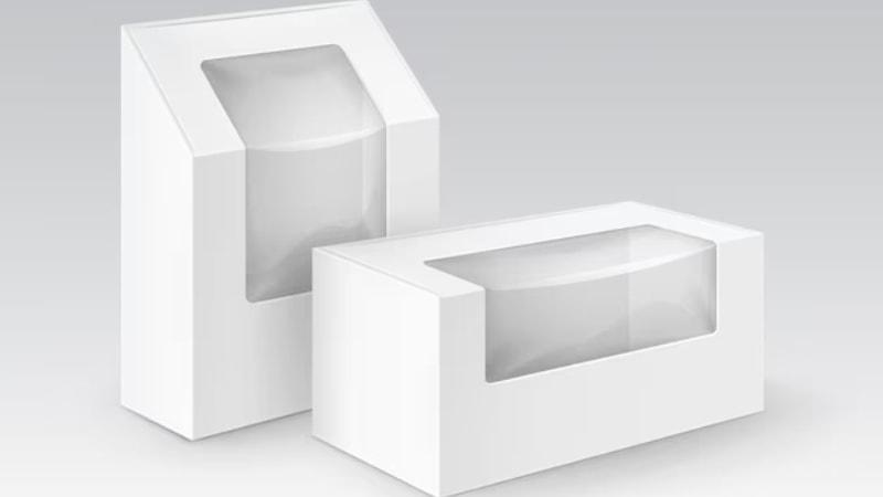 Two white window box packaging mockups with clear rectangular windows, one tall and one short, on a gray background.