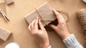 COVER - Women wrapping product in DIY paper packaging