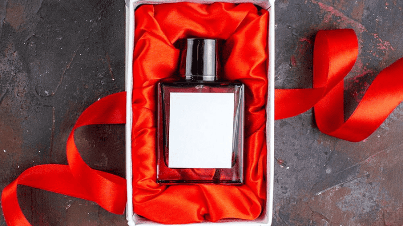 Luxury perfume bottle in white cardboard box