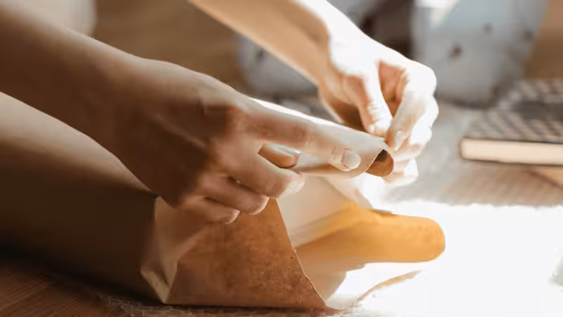 a woman packaging a book
