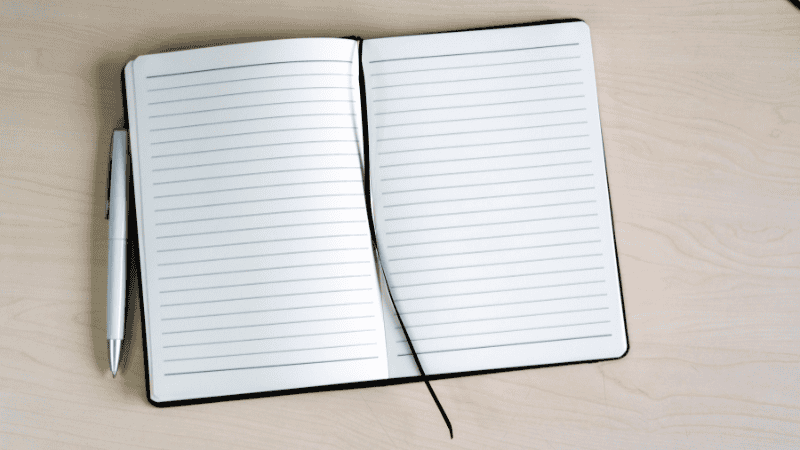 a notebook and a pen