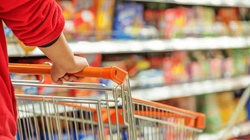 a man is go shopping in a supermarket