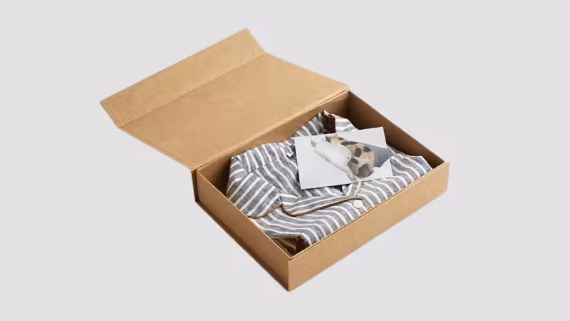 Blue and white striped pajamas in a kraft box