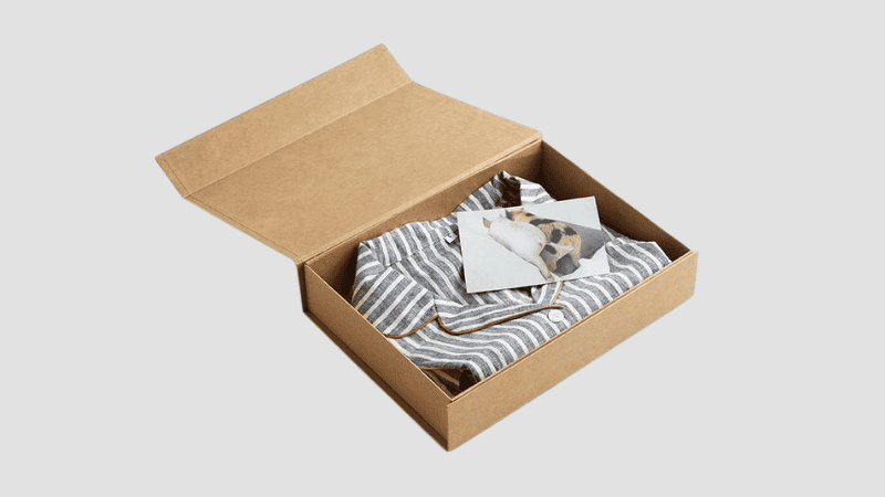 Blue and white striped pajamas in a kraft box