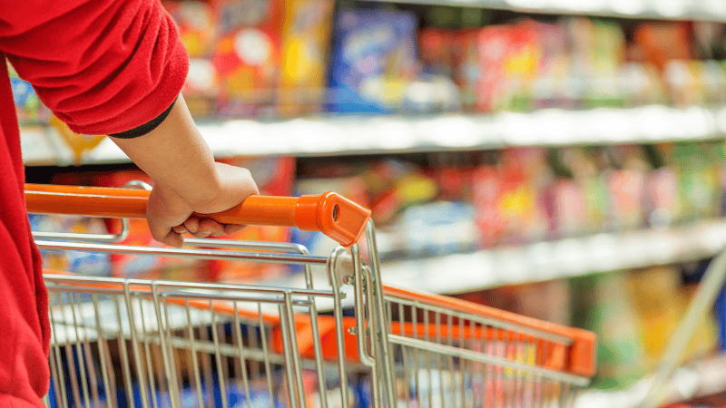 a man is go shopping in a supermarket