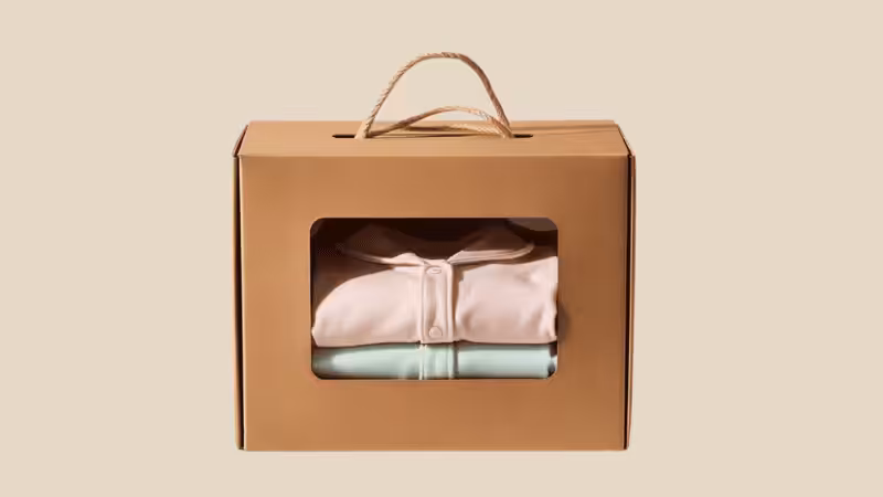 Pair of soft pajamas in a cardboard box with hemp string handle