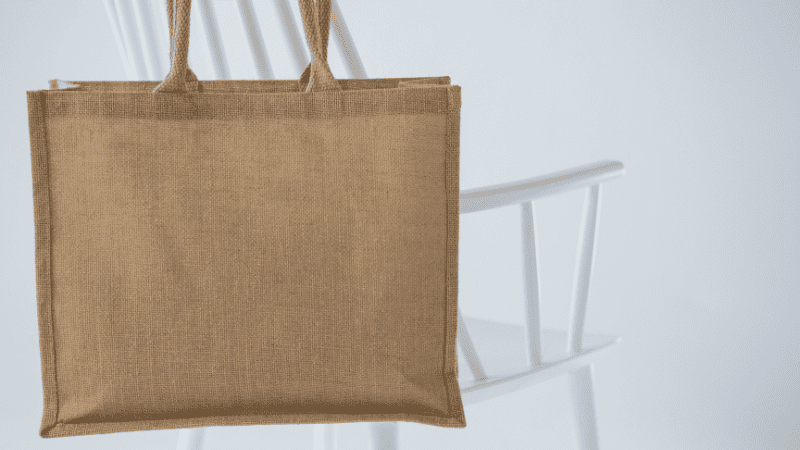 a jute bag hanging on a chair