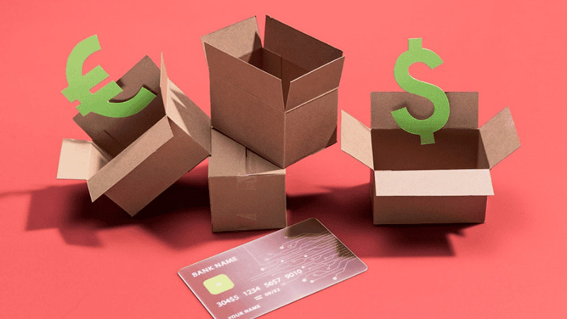 Cardboard boxes with dollar and euro signs