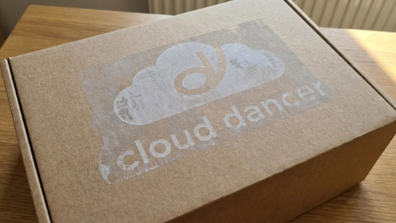 cloud dancer color printed on kraft mailer box