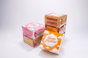 Stacked custom printed paper packaging boxes for Happy Mallows marshmallow dessert gift products