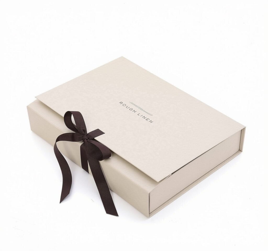 Custom beige flap rigid gift box printed brand logo tied with dark brown satin ribbon bow