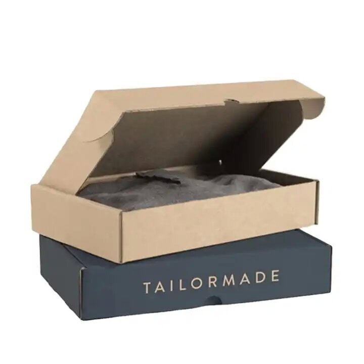 Two styles custom printed tuck top corrugated shipping boxes with Tailormade logo for apparel packaging